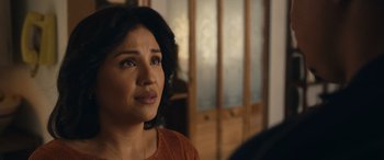 Movie still from “Flamin' Hot” (2023), directed by Eva Longoria – A person looking at the camera; Close Up shot, Over the shoulder angle