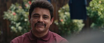 Movie still from “Flamin' Hot” (2023), directed by Eva Longoria – A person with a mustache; Close Up shot, Over the shoulder angle