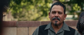 Movie still from “Flamin' Hot” (2023), directed by Eva Longoria – A person with a beard and mustache; Close Up shot, Over the shoulder angle