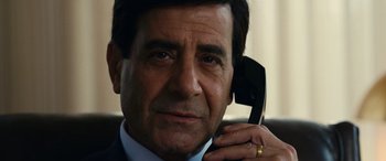 Movie still from “Flamin' Hot” (2023), directed by Eva Longoria – A person talking on a cell phone; Close Up shot, Low angle