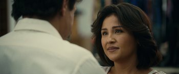 Movie still from “Flamin' Hot” (2023), directed by Eva Longoria – A person sitting in front of another person; Close Up shot, Over the shoulder angle