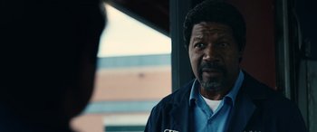 Movie still from “Flamin' Hot” (2023), directed by Eva Longoria – A person wearing a blue shirt; Close Up shot, Over the shoulder angle