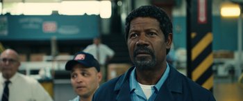 Movie still from “Flamin' Hot” (2023), directed by Eva Longoria – A man in a blue jacket and a man in a blue jacket; Close Up shot, Low angle