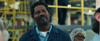 Movie still from “Flamin' Hot” (2023), directed by Eva Longoria – An older black man with a beard and mustache; Close Up shot, Low angle