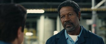 Movie still from “Flamin' Hot” (2023), directed by Eva Longoria – An older black man with a beard is looking at the camera; Close Up shot, Low angle