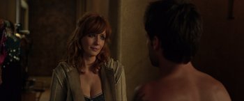 Movie still from “Flight” (2012), directed by Robert Zemeckis – A woman standing in front of a mirror looking at a man; Close Up shot, Over the shoulder angle