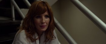 Movie still from “Flight” (2012), directed by Robert Zemeckis – A person with long red hair; Close Up shot, Over the shoulder angle
