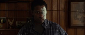 Movie still from “Flight” (2012), directed by Robert Zemeckis – A man with a bandage on his eye; Close Up shot, Over the shoulder angle