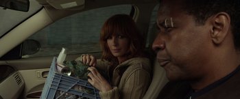Movie still from “Flight” (2012), directed by Robert Zemeckis – A man and a woman sitting in the back of a car; Close Up shot, Over the shoulder angle