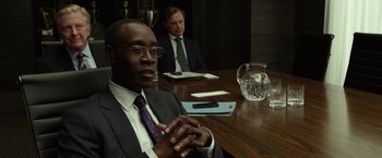 Movie still from “Flight” (2012), directed by Robert Zemeckis – Two men sitting at a table in a conference room; Medium shot, Over the shoulder angle
