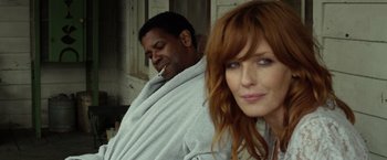 Movie still from “Flight” (2012), directed by Robert Zemeckis – A man and a woman wrapped in a blanket; Close Up shot, Low angle