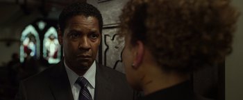 Movie still from “Flight” (2012), directed by Robert Zemeckis – A man and a woman looking at each other in a mirror; Close Up shot, Over the shoulder angle