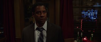 Movie still from “Flight” (2012), directed by Robert Zemeckis – A man in a suit and a tie; Close Up shot, Over the shoulder angle