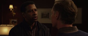 Movie still from “Flight” (2012), directed by Robert Zemeckis – Two men are facing each other in a room; Close Up shot, Over the shoulder angle