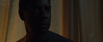 Movie still from “Flight” (2012), directed by Robert Zemeckis – A man's face in the dark; Close Up shot, Low angle