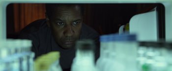 Movie still from “Flight” (2012), directed by Robert Zemeckis – A person looking at the camera; Close Up shot, Low angle