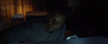 Movie still from “Flight” (2012), directed by Robert Zemeckis – A person sitting in front of a computer; Close Up shot, Low angle