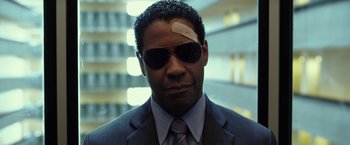 Movie still from “Flight” (2012), directed by Robert Zemeckis – A man with a bandage on his forehead; Close Up shot, Low angle