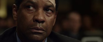 Movie still from “Flight” (2012), directed by Robert Zemeckis – A person with a bandage on his head; Close Up shot, Low angle