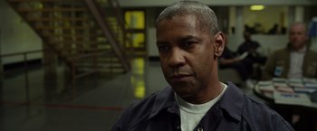 Movie still from “Flight” (2012), directed by Robert Zemeckis – A person wearing a shirt; Close Up shot, Over the shoulder angle