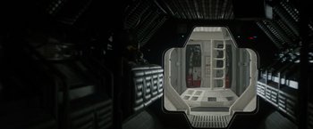 Movie still from “Alien” (1979), directed by Ridley Scott – An inside view of a space ship with the door open; Wide shot, Overhead angle