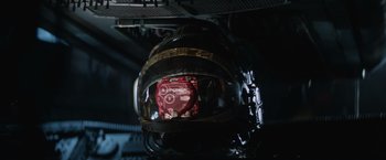 Movie still from “Alien” (1979), directed by Ridley Scott – View of a helmet on the side of a ship; Close Up shot, Overhead angle