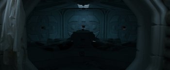 Movie still from “Alien” (1979), directed by Ridley Scott – An image of an empty room in the dark; Extreme Wide shot, Overhead angle