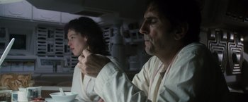 Movie still from “Alien” (1979), directed by Ridley Scott – A man and a woman sitting in a car; Close Up shot, Low angle