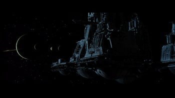 Movie still from “Alien” (1979), directed by Ridley Scott – An image of a space ship in the night sky; Extreme Wide shot, Low angle