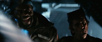 Movie still from “Alien” (1979), directed by Ridley Scott – A man in a black jacket and a man in a blue jacket; Close Up shot, Low angle