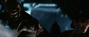 Movie still from “Alien” (1979), directed by Ridley Scott – View of a person wearing a leather jacket; Close Up shot, Low angle