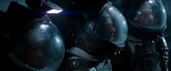 Movie still from “Alien” (1979), directed by Ridley Scott – A man in a space suit and a helmet; Close Up shot, Overhead angle