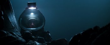 Movie still from “Alien” (1979), directed by Ridley Scott – A person in a diving suit in the water; Medium shot, Low angle