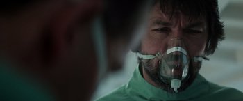 Movie still from “Alien” (1979), directed by Ridley Scott – A person wearing a mask; Close Up shot, Over the shoulder angle