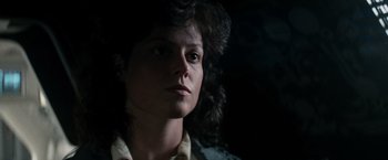 Movie still from “Alien” (1979), directed by Ridley Scott – A person wearing a shirt; Close Up shot, Low angle