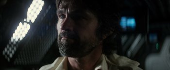 Movie still from “Alien” (1979), directed by Ridley Scott – A person with a beard; Close Up shot, Over the shoulder angle