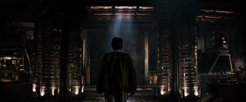 Movie still from “Alien” (1979), directed by Ridley Scott – A man standing in front of an open door; Wide shot, Low angle