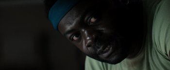 Movie still from “Alien” (1979), directed by Ridley Scott – A person with a blue hat on; Close Up shot, Low angle