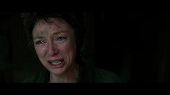 Movie still from “Alien” (1979), directed by Ridley Scott – A person with a crying face; Close Up shot, Low angle