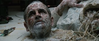 Movie still from “Alien” (1979), directed by Ridley Scott – A man covered in shaving cream and shaving cream on his face; Close Up shot, High angle