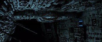 Movie still from “Alien” (1979), directed by Ridley Scott – An overhead view of an alien ship in the dark; Extreme Wide shot, Overhead angle