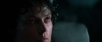 Movie still from “Alien” (1979), directed by Ridley Scott – A person's face with water on their face; Close Up shot, Low angle