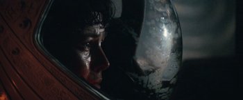 Movie still from “Alien” (1979), directed by Ridley Scott – A man's face in a helmet; Close Up shot, Low angle