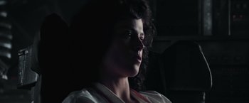Movie still from “Alien” (1979), directed by Ridley Scott – A person in a dark room; Close Up shot, Low angle
