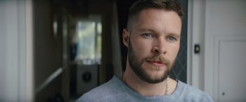 Movie still from “Flora and Son” (2023), directed by John Carney – A person with a beard; Close Up shot, Low angle