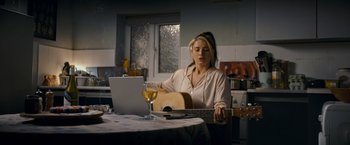 Movie still from “Flora and Son” (2023), directed by John Carney – Medium shot, High angle