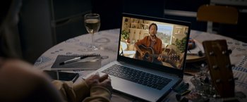 Movie still from “Flora and Son” (2023), directed by John Carney – Medium shot, High angle