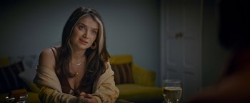 Movie still from “Flora and Son” (2023), directed by John Carney – A beautiful young woman sitting at a table; Close Up shot, Over the shoulder angle