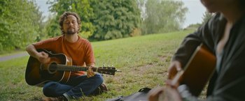 Movie still from “Flora and Son” (2023), directed by John Carney – Medium shot, Over the shoulder angle