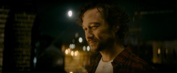 Movie still from “Flora and Son” (2023), directed by John Carney – A person wearing a plaid shirt; Close Up shot, Over the shoulder angle